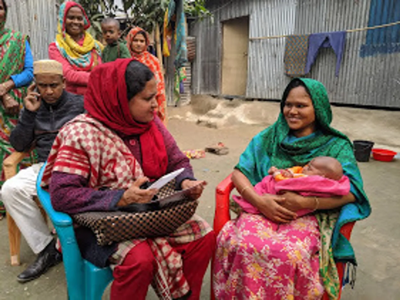 Community Health Worker in Bangladesh declaring a birth in the community during PoC in Bangladesh. Photo courtesy of Plan International